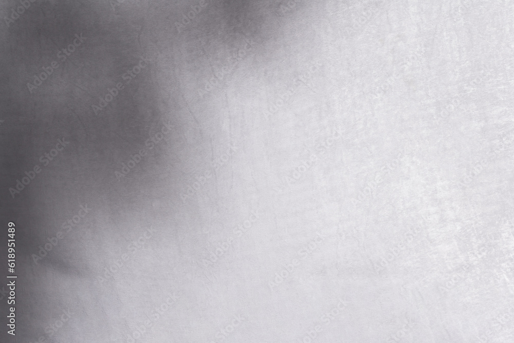 Blur shadow of leaves on white fabric. white cloth background soft wrinkled fabric patrem and surface Blur shadow of leaves on white fabric. white cloth background soft wrinkled fabric patrem and surface