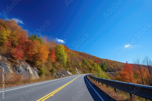 scenic highway in the autumn, with colorful leaves and clear blue sky, created with generative ai