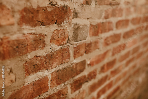 Old brick wall that has cracked and been patched, background image photo