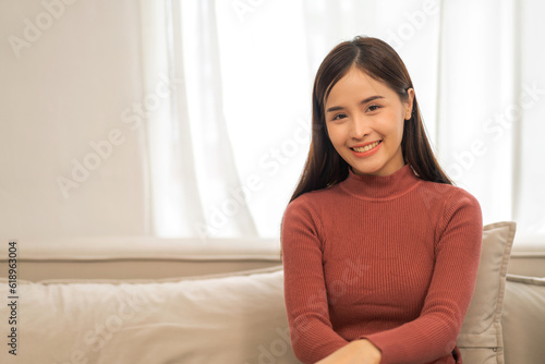 Portrait of smiling beautiful pretty asian woman clean fresh healthy white skin posing smile, skincare, lady, model, cosmetic, fashion.Girl felling relax and enjoy on sofa at home.asia beauty