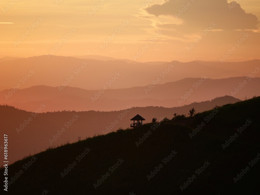 Tropical landscape panorama with sunset or sunrise dramatic sky. Jungle rainforest with lush vegetation and majestic cloudscape beautiful wild scenic nature. Aerial view