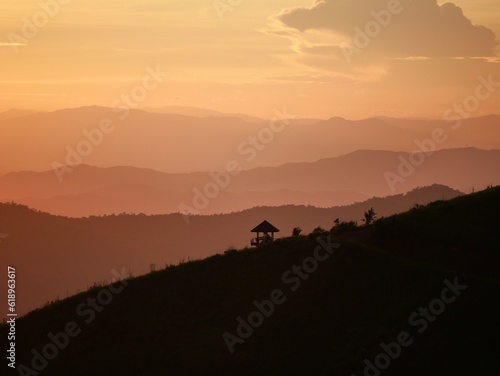 Tropical landscape panorama with sunset or sunrise dramatic sky. Jungle rainforest with lush vegetation and majestic cloudscape beautiful wild scenic nature. Aerial view