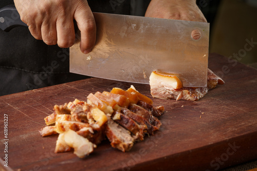 Fresh pork head being sliced