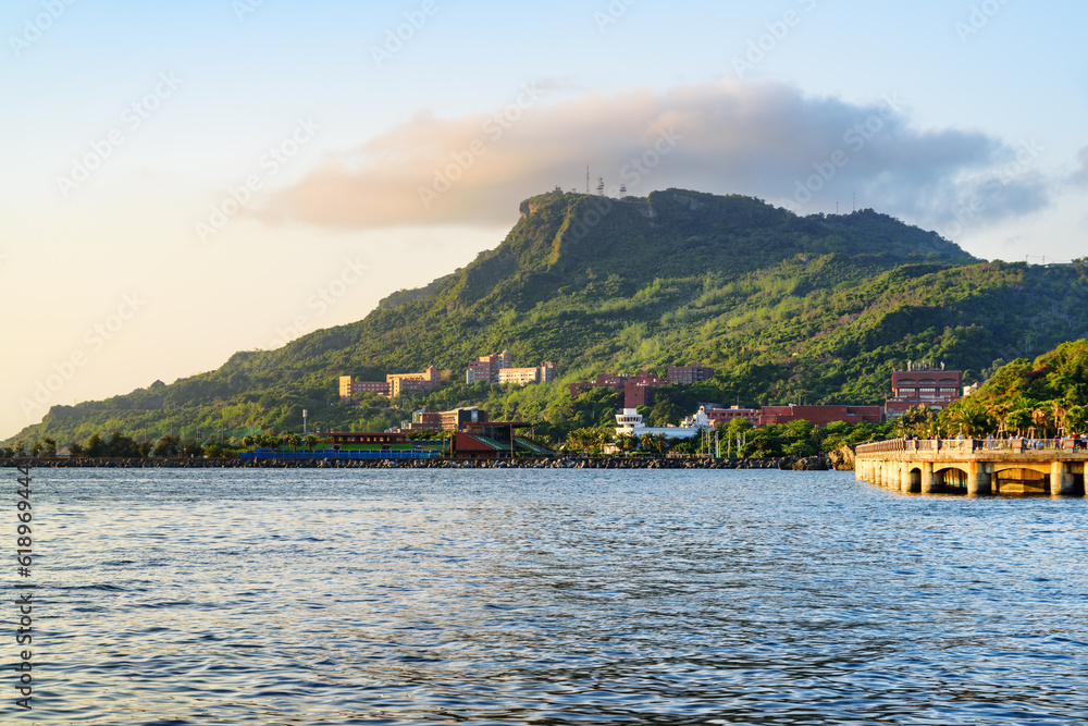 Kaohsiung Outer Harbor and green wooded mountain, Taiwan