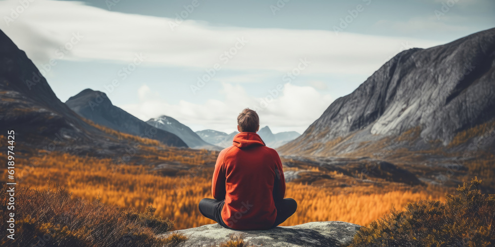 Back view of a man sitting in yoga pose in mountains, Generative AI