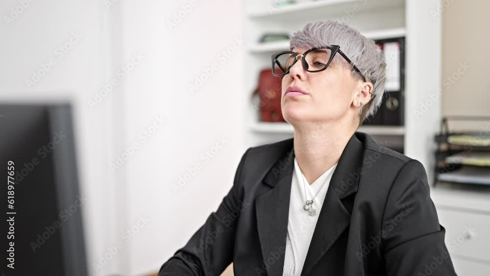 Young woman business worker stressed working at office Young woman business worker stressed working at office