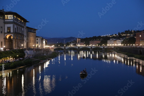 Sunset over the River Arno in the summer. Beautiful Ponte Vecchio city. Night view of the old town country. Dusk over the medieval city. Natural beauty in the evening. © Liudmyla Leshchynets