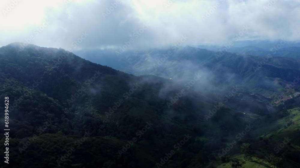 Aerial view of the trees in the valley with fog in the morning. Landscape of misty valley and mountain clouds in thailand. The dawn of the mountains with the sea of mist. Aerial view of the trees in the valley with fog in the morning. Landscape of misty valley and mountain clouds in thailand. The dawn of the mountains with the sea of mist.