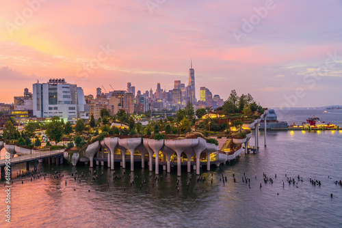 Cityscape of downtown Manhattan skyline with the Little Island Public Park in New York City at sunrise photo
