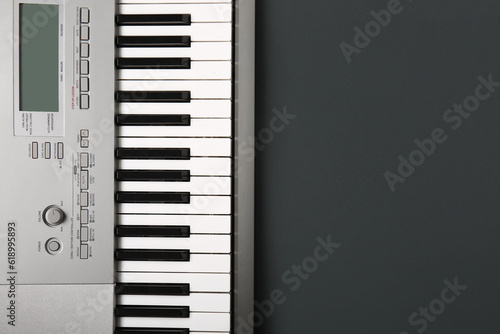 Modern synthesizer keyboard on black background