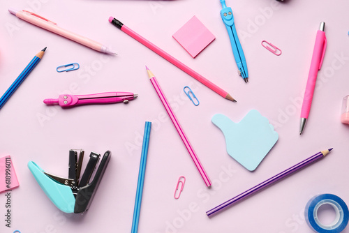 Composition with stationery supplies on pink background