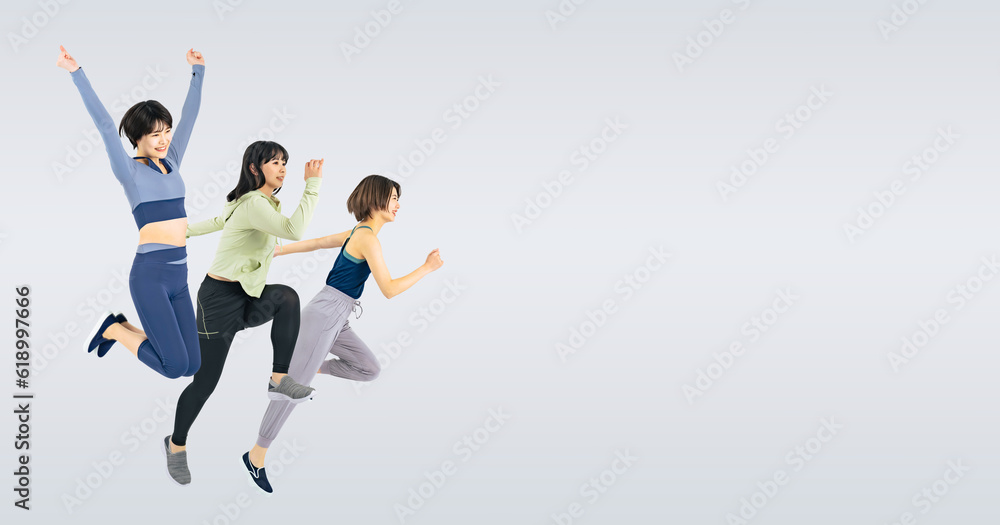 スポーツウェアを着てジャンプする女性のグループ　（切り抜き背景透過PNGも販売しております。作成者リンクから「PNG」で検索してください）