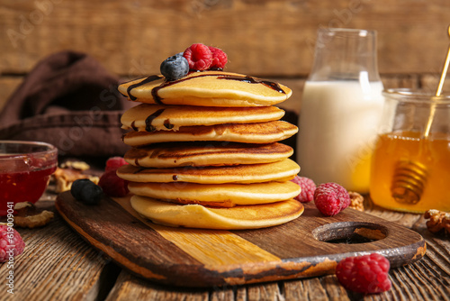 Stack of golden pancakes wi...