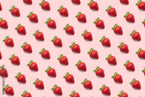 Ripe red strawberries in diagonal rows isolated seamless pattern on light pink background, top view