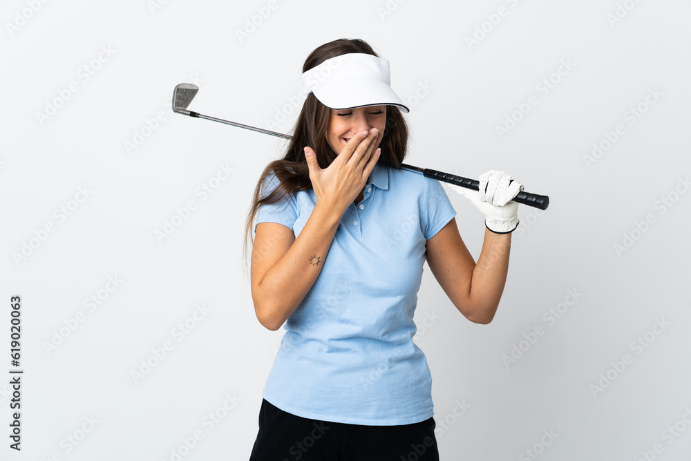 Young golfer woman over isolated white background happy and smiling covering mouth with hand Young golfer woman over isolated white background happy and smiling covering mouth with hand
