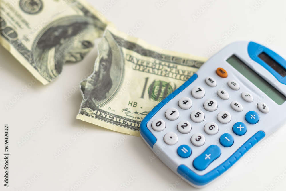 Torn dollar bill with American flag. Debt ceiling, stock market and financial concept. Torn dollar bill with American flag. Debt ceiling, stock market and financial concept.
