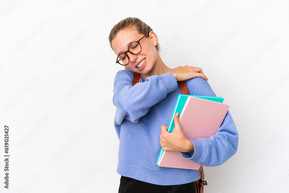 Young student caucasian woman isolated on white background suffering from pain in shoulder for having made an effort Young student caucasian woman isolated on white background suffering from pain in shoulder for having made an effort