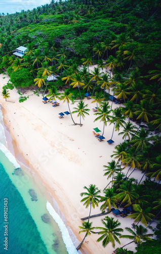 Aerial view of beautiful tropical beach with coconut palm trees, blue lagoon and white sand. Generative AI.