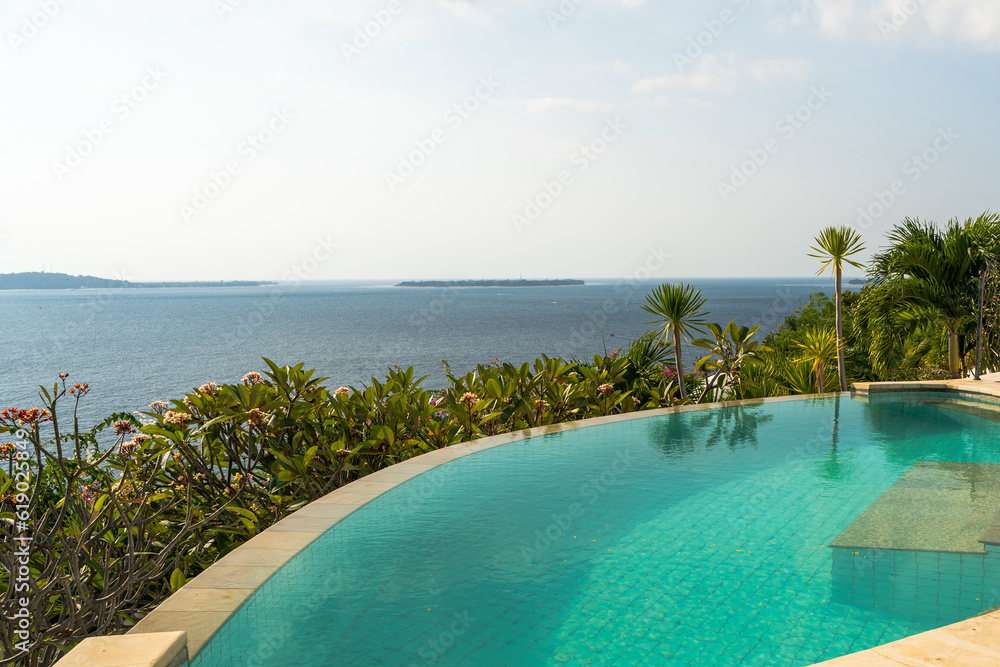 Fototapeta premium Luxury hotel infinity pool in summer