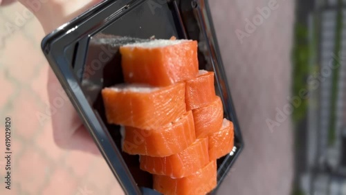 Japanese sushi traditional japaneese food.Roll made of salmon - philadelfia. Vertical video. High quality FullHD footage photo