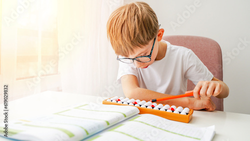 The boy is engaged in abacus, mental arithmetic for children