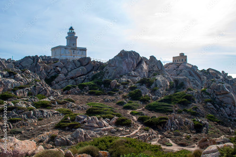 Rocky sea coast with a lighthouse in the Capo D'Orso area on the island of Sardinia, Italy