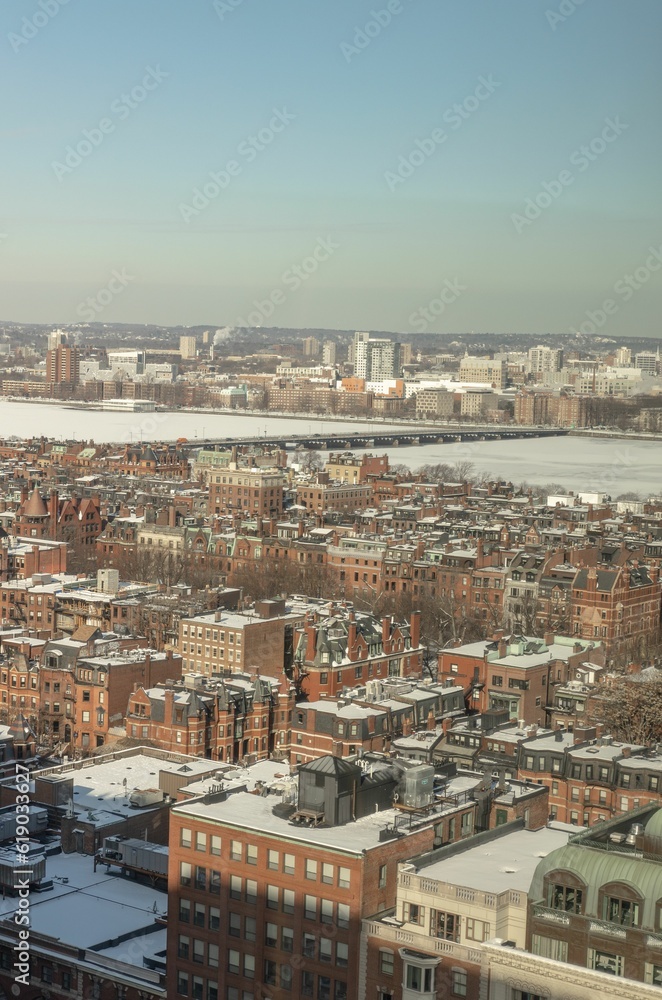 Bostons back bay neighborhood in the winter with the Charles river frozen