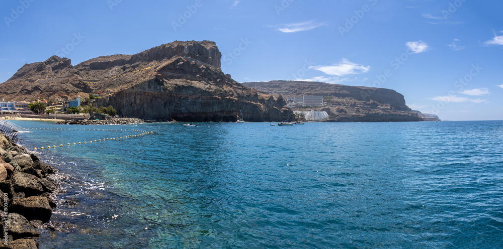 Puerto de Mogán, coastal town that has its back covered by a rocky and dark hill that reaches the sea, while in front it enjoys the best views of the Atlantic Ocean, Gran Canaria, Spain
