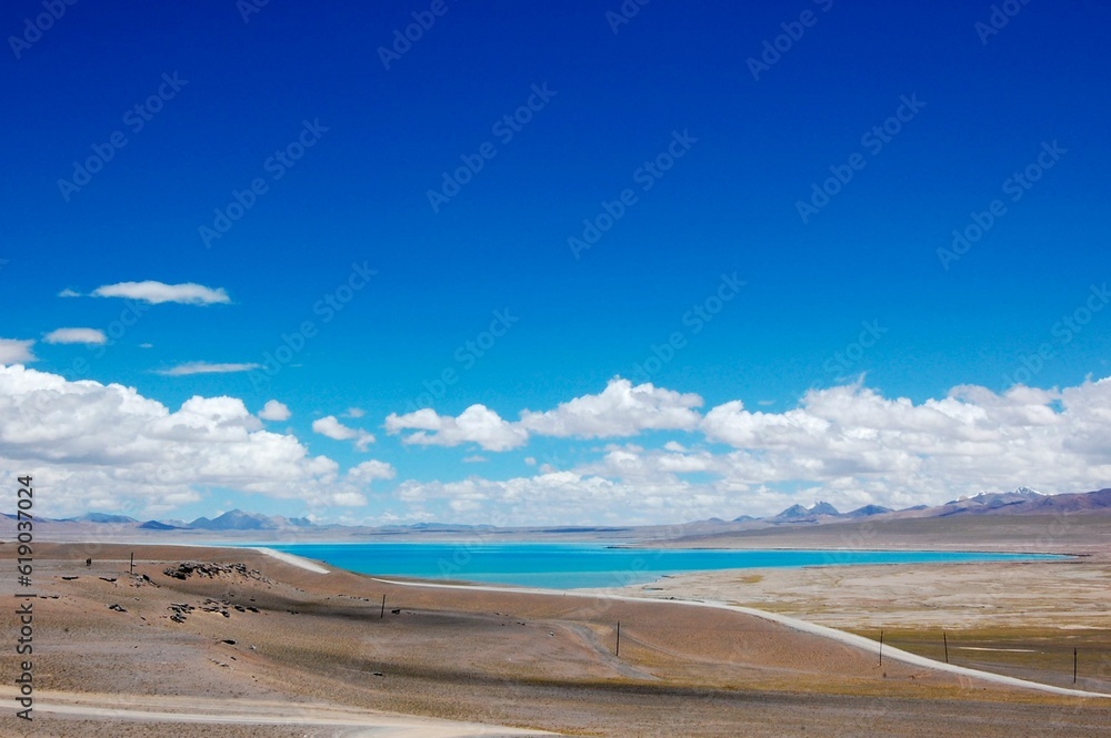 Namucuo lake on a sunny day with cloudy sky background Namucuo lake on a sunny day with cloudy sky background