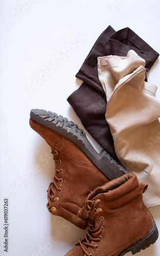 Brown shoes and shorts on a white background