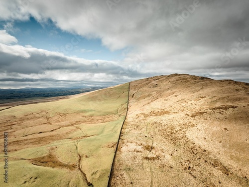 Scenic view of rolling hills and clouds in the sky, creating a tranquil atmosphere. Tebay, England. photo