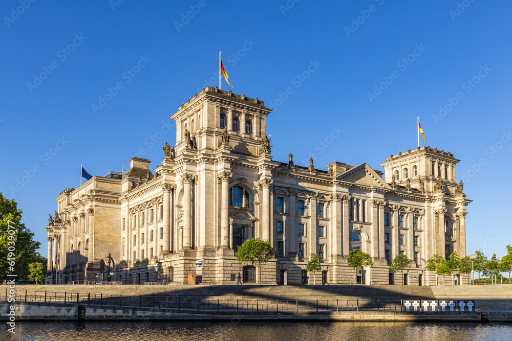View across the River Spree of the historic Reichstag building in the city of Berlin, Germany.