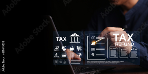 Concept of tax payment optimisation business finance,Man using calculator and taxes icon on technology screen,income tax and property, individuals and corporations such as VAT