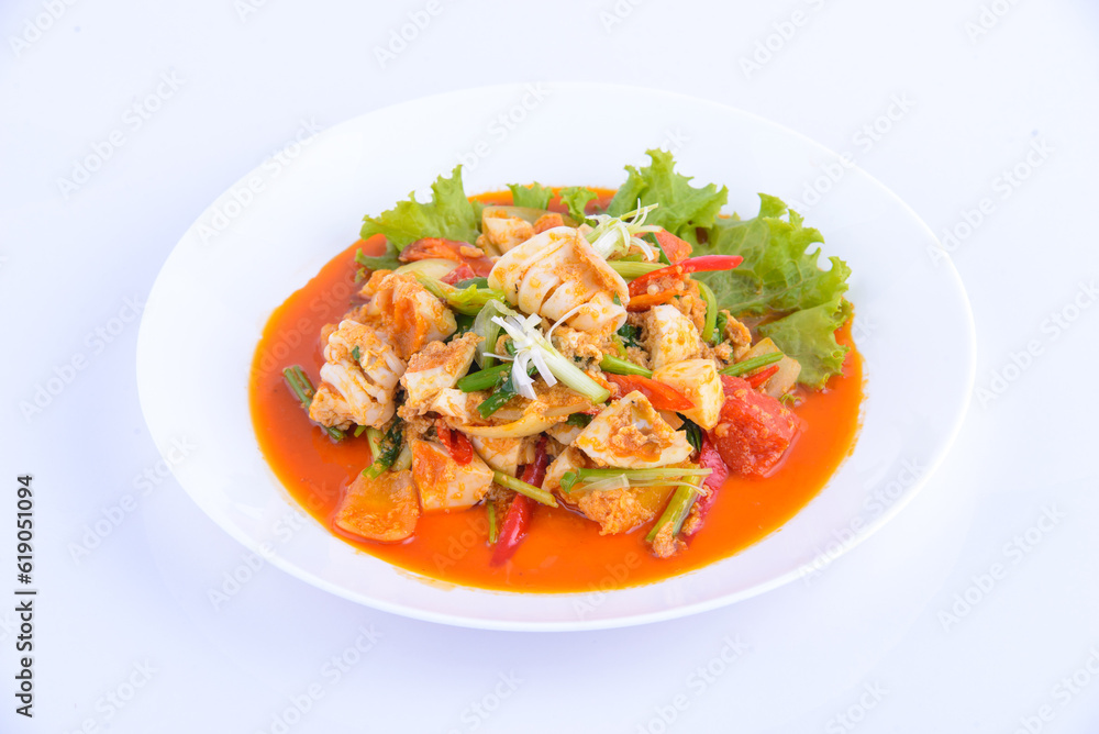 Thai favourite food. Stir Fried Squid with Curry on the white dish. Thai favourite food. Stir Fried Squid with Curry on the white dish.