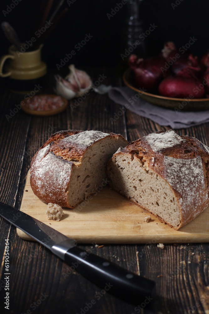 A loaf of rye bread in low key