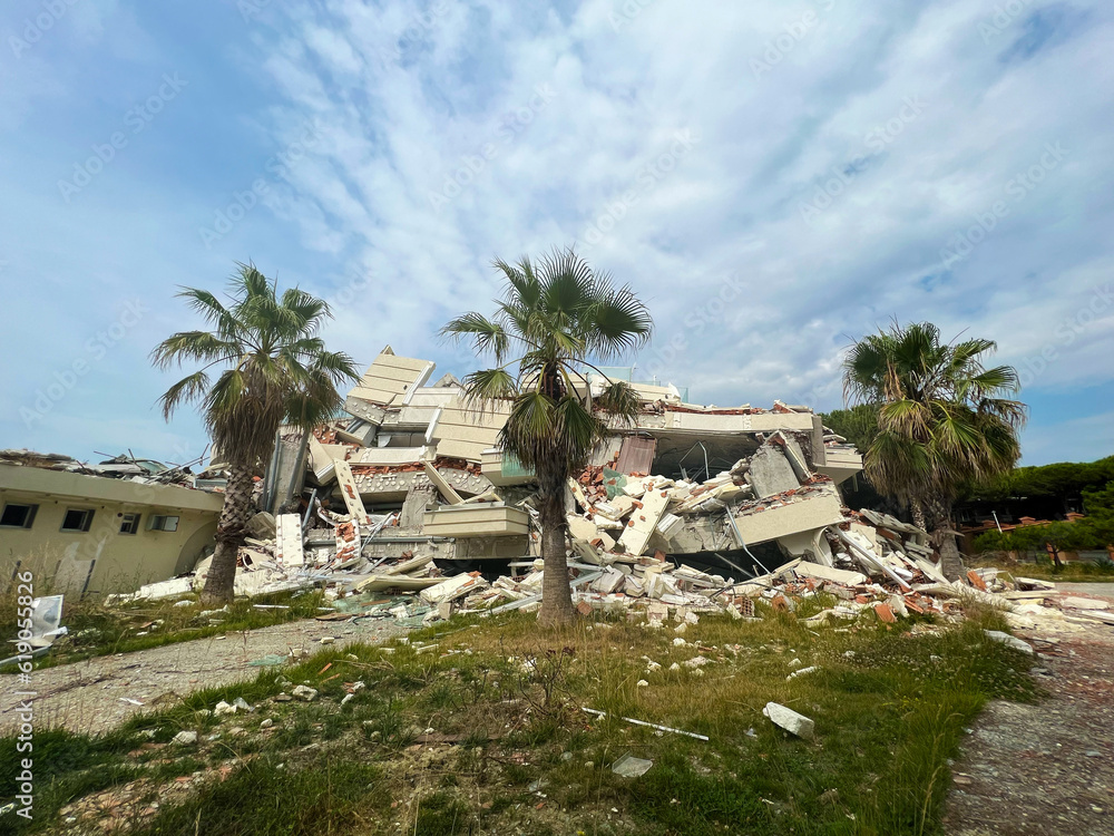 Decay and Resilience: The Abandoned Oasis – A Photographic Journey of a Beach Hotel's Ruins Amidst Palm Trees