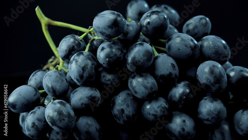 bunch of ripe dark grape isolated on black background