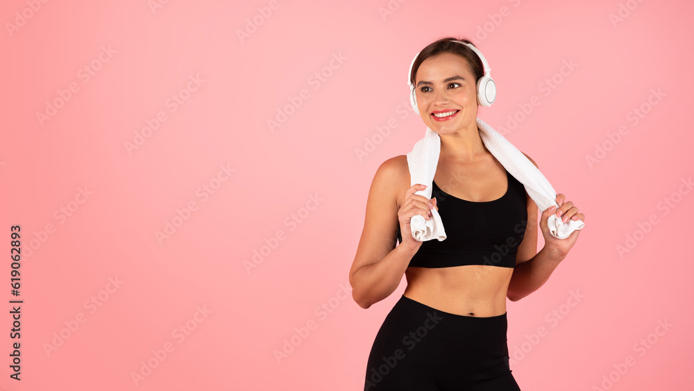 Portrait Of Young Beautiful Sporty Female In Wireless Headphones Over Pink Background Portrait Of Young Beautiful Sporty Female In Wireless Headphones Over Pink Background