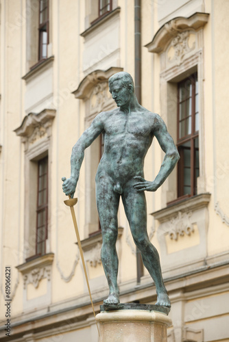 Fencer with a sword in front of the Wroclaw University building in Poland © Sergey