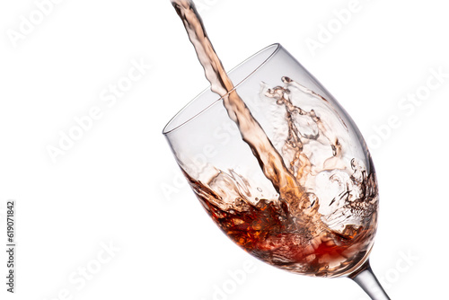 red wine pouring into glass, isolated on white