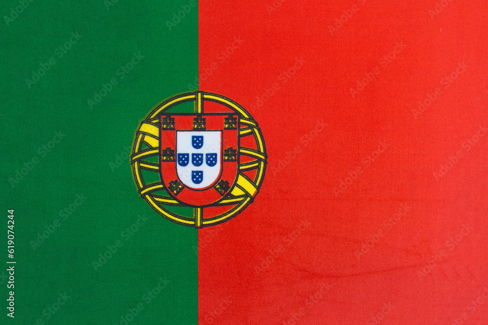 the national flag of Portugal on a fabric basis close-up the national flag of Portugal on a fabric basis close-up