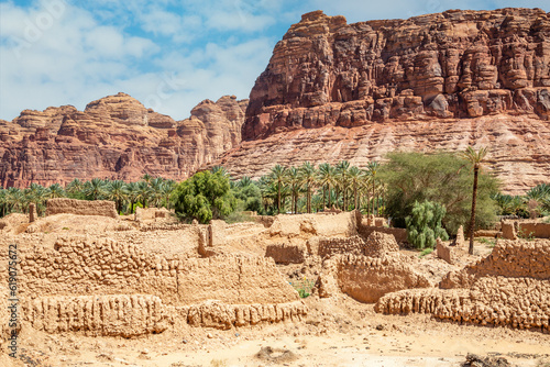 Al Ula ruined old town streets with palms along the road, Saudi Arabia photo