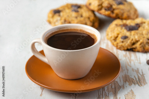 Coffee served with chocolate biscuits , autumn composition