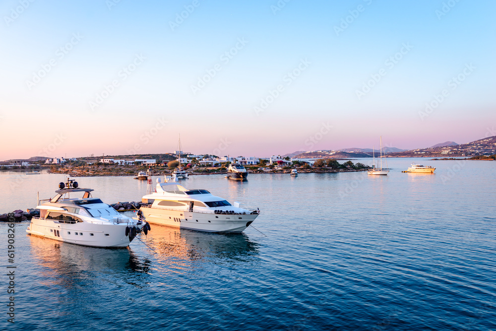 The port of Antiparos in the evening, with Paros Island in the background. Cyclades Islands, Greece.