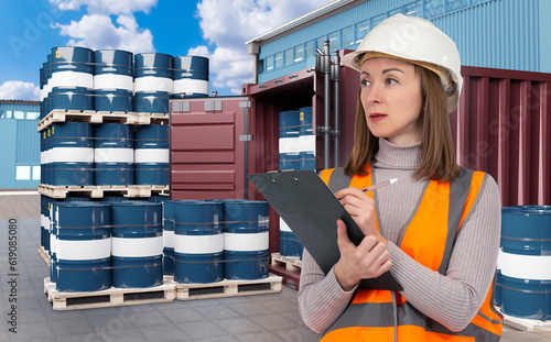 Logistics woman. Barrels of...