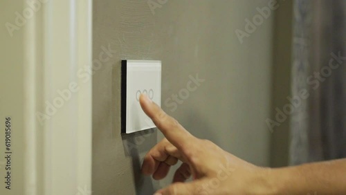 Capacitive touch switch to control room lighting on and off in luxury hotels. photo
