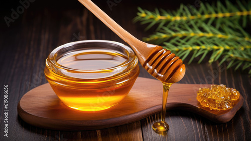 Raw Organic Pure Manuka Honey with Honey Dipper. With Dark Wood Themed Background. photo