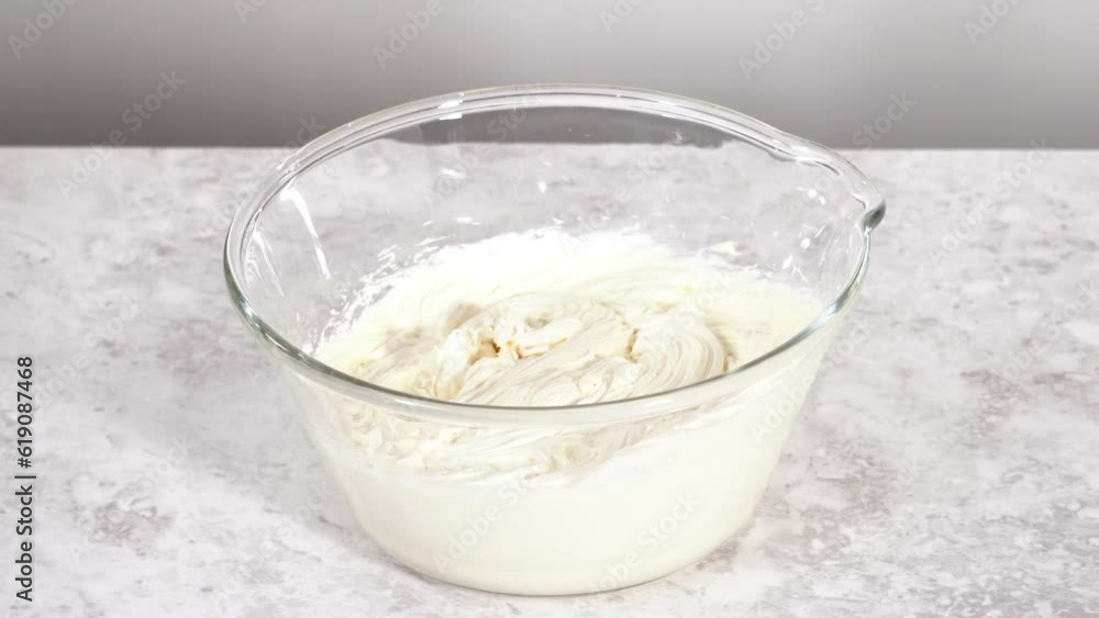 Preparing store-bought buttercream frosting to make unicorn rainbow chocolate cupcakes. Preparing store-bought buttercream frosting to make unicorn rainbow chocolate cupcakes.