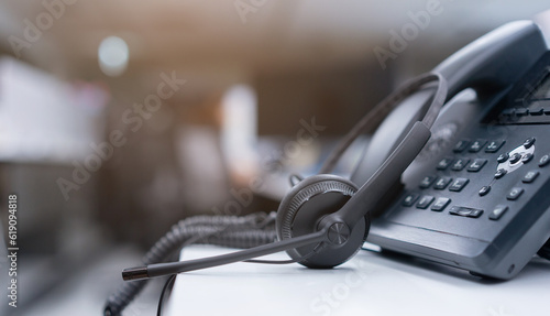 Fotografia close up black headset with telephone in operation room to communicate with vend