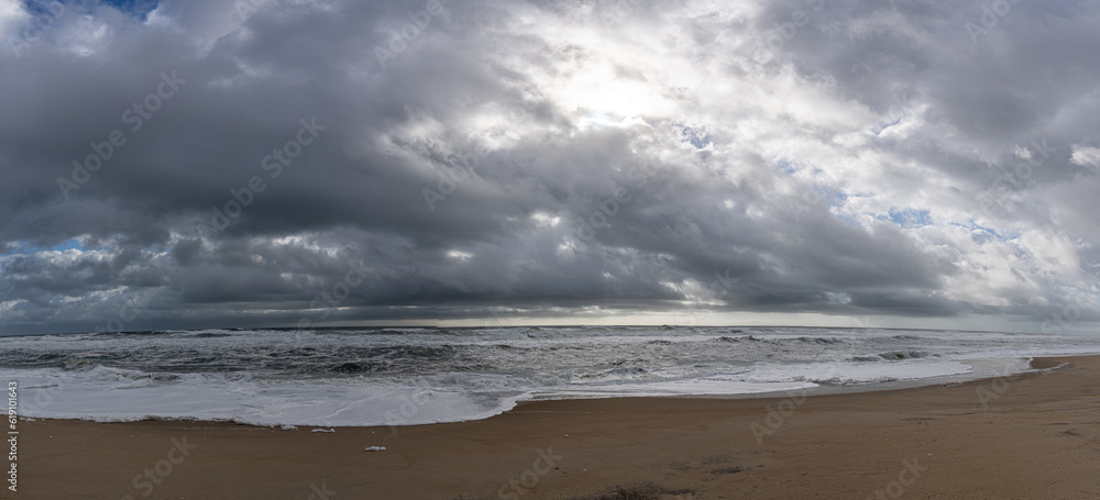 Fototapeta premium Panoramic View of Large Storm Clouds over Empty Beach